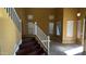 Spacious foyer featuring stairs, tile flooring with design, and abundant natural light from multiple windows at 7511 S 45Th Dr, Laveen, AZ 85339