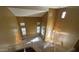 Inviting foyer with high ceilings, numerous windows, staircase, and decorative tile, creating a grand entrance at 7511 S 45Th Dr, Laveen, AZ 85339