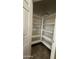 Organized pantry with shelving and tile flooring, providing efficient storage for kitchen supplies at 7511 S 45Th Dr, Laveen, AZ 85339