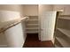 Spacious walk-in closet with ample shelving for storage and organization at 7511 S 45Th Dr, Laveen, AZ 85339