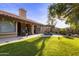 Outdoor patio and grassy backyard perfect for gatherings and entertaining at 76 W Stacey Ln, Tempe, AZ 85284