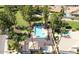 Overhead view of the resort-style community pool surrounded by tropical palm trees and manicured landscaping at 76 W Stacey Ln, Tempe, AZ 85284