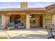 Relaxing covered patio featuring comfortable seating and a view of the yard at 76 W Stacey Ln, Tempe, AZ 85284