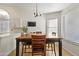 Casual dining area adjacent to the kitchen with windows and a view of the backyard at 76 W Stacey Ln, Tempe, AZ 85284