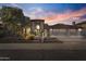 Charming home featuring well-maintained landscaping, three car garage, and a lovely desert yard at 76 W Stacey Ln, Tempe, AZ 85284