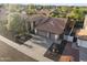 Aerial view of this lovely house showing the front yard, desert landscaping, and a three-car garage at 76 W Stacey Ln, Tempe, AZ 85284