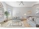 Bright living room featuring neutral tones, vaulted ceiling, large windows, and comfortable seating at 76 W Stacey Ln, Tempe, AZ 85284