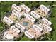 Aerial view showcasing the community layout, buildings, tennis courts, and landscaping at 7920 E Camelback Rd # 203, Scottsdale, AZ 85251
