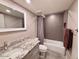 Bathroom featuring a vanity with granite countertop, a tub, and modern fixtures at 7920 E Camelback Rd # 203, Scottsdale, AZ 85251