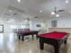 Spacious game room with two pool tables, tile flooring, and recessed lighting at 7920 E Camelback Rd # 203, Scottsdale, AZ 85251