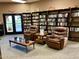 Cozy library space with comfortable seating, built-in bookshelves and exterior access at 7920 E Camelback Rd # 203, Scottsdale, AZ 85251