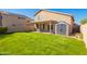 Green backyard and covered patio at 8637 W Kathleen Rd, Peoria, AZ 85382
