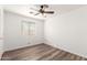 Bright bedroom with wood-look flooring and ceiling fan fixture at 8637 W Kathleen Rd, Peoria, AZ 85382