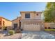Two-story home featuring a two-car garage, neutral color scheme and low maintenance landscaping at 8637 W Kathleen Rd, Peoria, AZ 85382