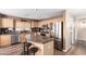 Open kitchen featuring stainless steel appliances, an island with seating, and plenty of counter space at 8637 W Kathleen Rd, Peoria, AZ 85382