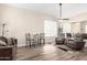 Cozy living room showcases wood-look floors, a ceiling fan, and comfortable seating at 8637 W Kathleen Rd, Peoria, AZ 85382