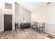 Inviting living room with soaring ceiling, wood-look floors, and neutral paint at 8637 W Kathleen Rd, Peoria, AZ 85382