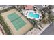Aerial view of community tennis courts, swimming pool, and spa for luxurious leisure at 8804 E Sunnyside Dr, Scottsdale, AZ 85260