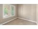 Bedroom featuring neutral carpet, a window with white blinds, and outlets for convenience at 8804 E Sunnyside Dr, Scottsdale, AZ 85260