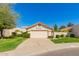 Charming single-story home with well-manicured lawn, mature trees, and a two-car garage at 8804 E Sunnyside Dr, Scottsdale, AZ 85260