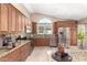 Well-lit kitchen featuring granite countertops, stainless steel appliances, and custom cabinetry at 8804 E Sunnyside Dr, Scottsdale, AZ 85260