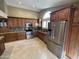 Spacious kitchen features stainless steel appliances, granite countertops, and tile backsplash at 8804 E Sunnyside Dr, Scottsdale, AZ 85260