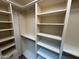 Walk-in closet with adjustable shelving for optimal storage and organization solutions at 8804 E Sunnyside Dr, Scottsdale, AZ 85260