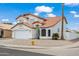 Two-story home featuring a red tile roof, a two car garage, and desert landscaping at 9818 W Pontiac Dr, Peoria, AZ 85382