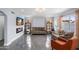 Living room with a modern fireplace, tile floors, neutral furnishings, and natural light at 9818 W Pontiac Dr, Peoria, AZ 85382