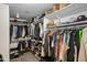 Spacious walk-in closet with ample shelving and hanging space for organized storage at 9818 W Pontiac Dr, Peoria, AZ 85382