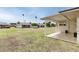 Spacious backyard with lush grass and a view of neighboring homes at 10815 W Hatcher Rd, Sun City, AZ 85351