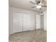 Bedroom featuring neutral colors and a large closet at 10815 W Hatcher Rd, Sun City, AZ 85351