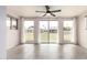 Sunlit living room with large windows offering views of the outdoor space at 10815 W Hatcher Rd, Sun City, AZ 85351