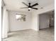 Open concept living room with tile flooring, natural light, and modern fixtures at 10815 W Hatcher Rd, Sun City, AZ 85351
