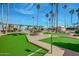 Well maintained miniature golf course with lush landscaping at 10815 W Hatcher Rd, Sun City, AZ 85351