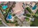 Stunning aerial view of home featuring a pool, lake access, and lush landscaping at 11101 W Sieno Pl, Avondale, AZ 85392
