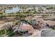 Gorgeous aerial view of a property with a pool, lush greenery, and beautiful surrounding neighborhood with mature trees at 11101 W Sieno Pl, Avondale, AZ 85392
