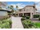 A lush backyard featuring a gazebo, outdoor kitchen and tropical landscaping at 11101 W Sieno Pl, Avondale, AZ 85392