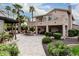 A lush backyard featuring a gazebo, patio, tropical plants, and a view of the home at 11101 W Sieno Pl, Avondale, AZ 85392