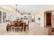 Spacious dining area with open kitchen, stainless appliances, and tile flooring at 11101 W Sieno Pl, Avondale, AZ 85392
