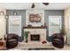 Close-up of the stone fireplace, showing charming mantel and accent decor at 11101 W Sieno Pl, Avondale, AZ 85392