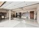 Open garage showing epoxy flooring and plenty of built in storage at 11101 W Sieno Pl, Avondale, AZ 85392