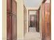 Inviting hallway with tile flooring and access to multiple rooms at 11101 W Sieno Pl, Avondale, AZ 85392