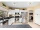 Bright kitchen featuring stainless steel appliances and tile flooring at 11101 W Sieno Pl, Avondale, AZ 85392