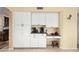 Bright kitchen featuring white cabinets, stainless steel appliances, and tile flooring at 11101 W Sieno Pl, Avondale, AZ 85392
