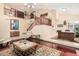 Open-concept living room with beautiful staircase, tile entryway, and hardwood floor accents at 11101 W Sieno Pl, Avondale, AZ 85392