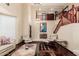 Open-concept living room with beautiful staircase, high ceilings, and lots of natural light at 11101 W Sieno Pl, Avondale, AZ 85392