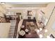 Aerial view of living room with wood flooring, fireplace and bright windows at 11101 W Sieno Pl, Avondale, AZ 85392