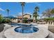 Serene backyard features a pool, hot tub, and landscaped patio area, perfect for outdoor relaxation and entertainment at 11101 W Sieno Pl, Avondale, AZ 85392