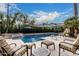 Stunning pool with a tanning ledge and attached waterfall spa offers a luxurious escape in your own backyard at 11101 W Sieno Pl, Avondale, AZ 85392